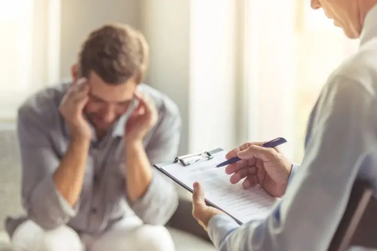 A client speaking with a counselor in a welcoming setting